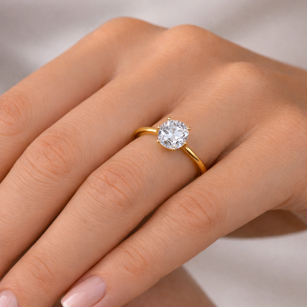 Solitaire Cushion Diamond Ring worn on hand in 18K Yellow Gold