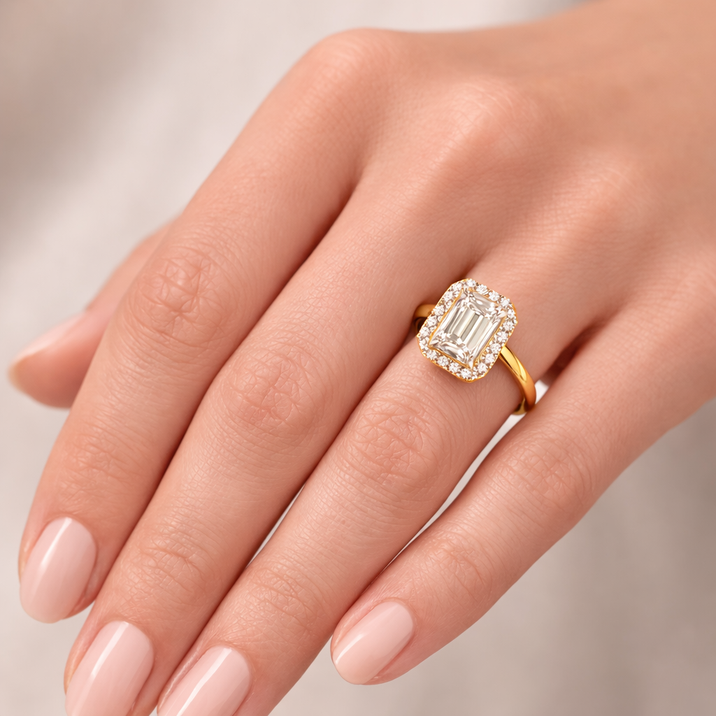 Emerald Halo Radiance worn on hand in 18K Yellow Gold