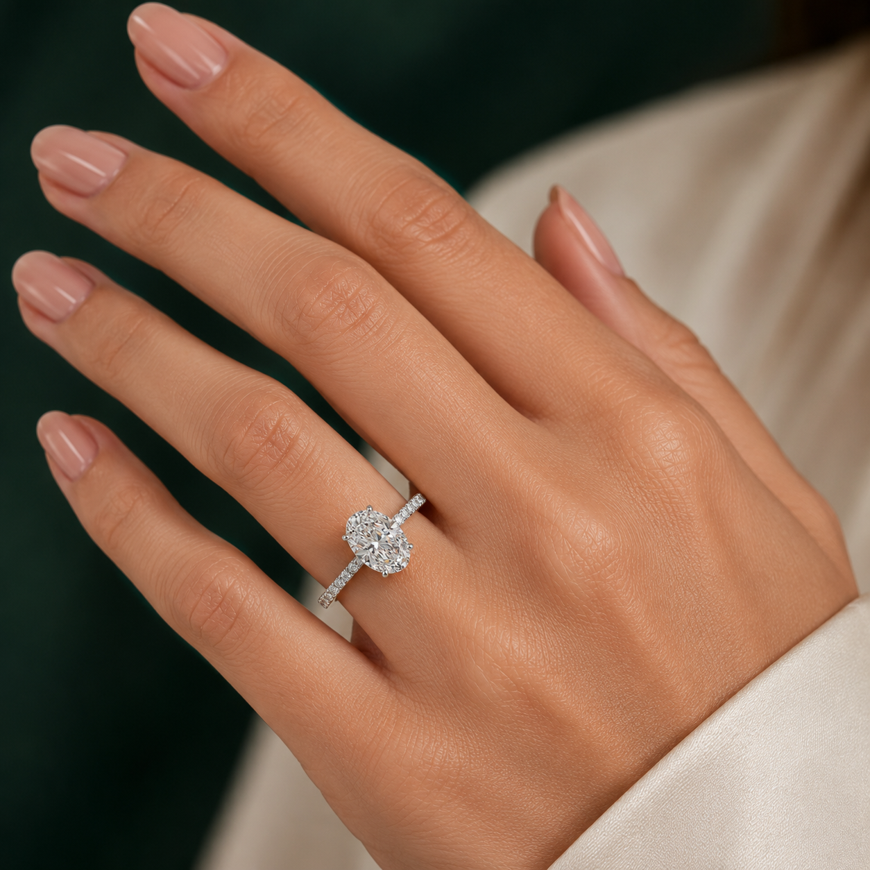 Oval Pavé Solitaire Diamond Engagement Ring worn on hand in 18K White Gold