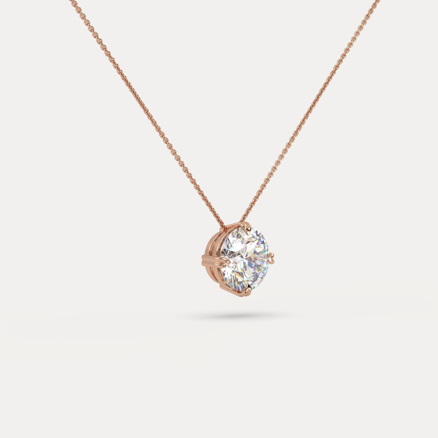 angled view of Solitaire Round Cut Diamond Pendant in 18K Rose Gold