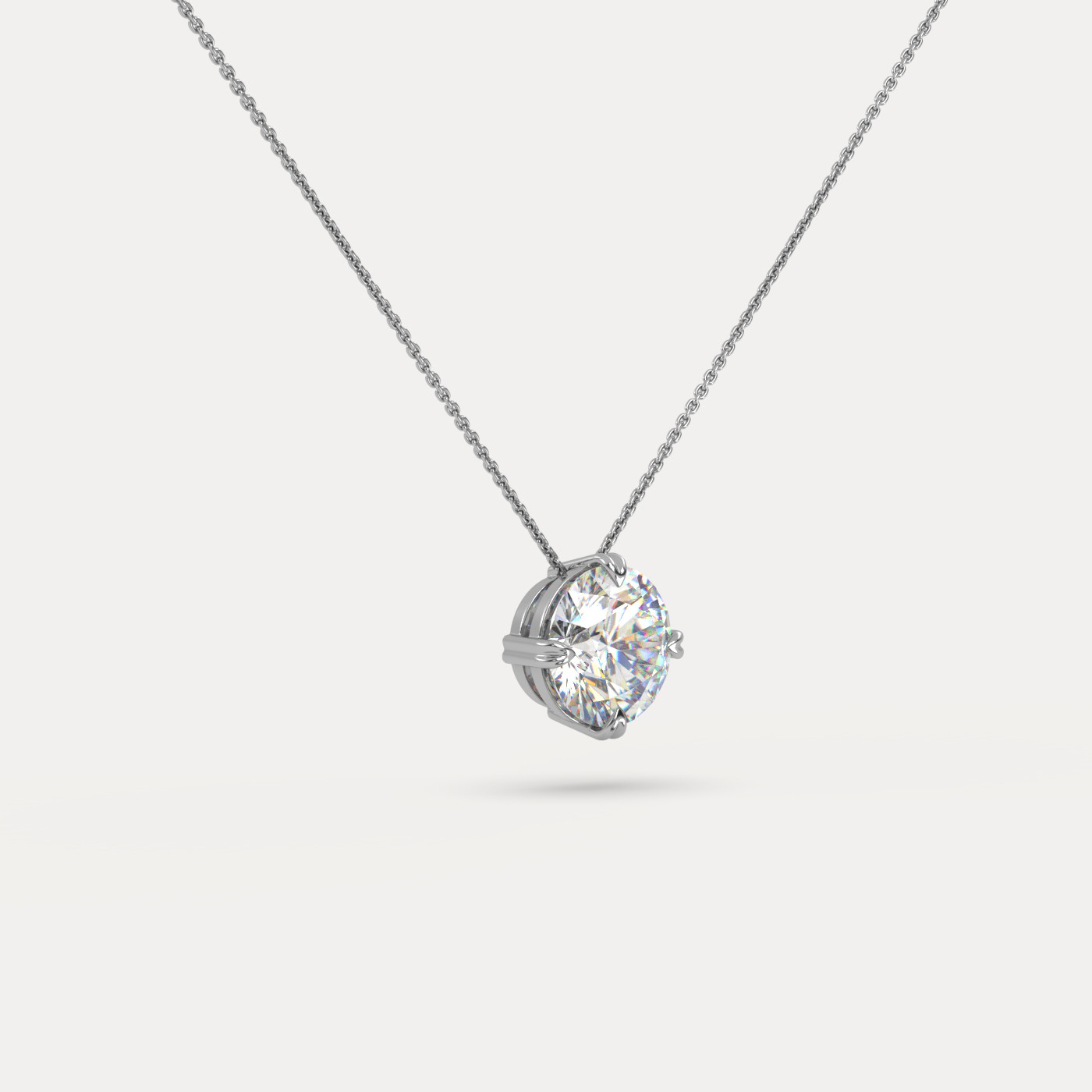 angled view of Solitaire Round Cut Diamond Pendant in 18K White Gold