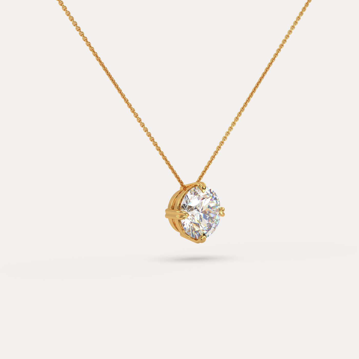 angled view of Solitaire Round Cut Diamond Pendant in 18K Yellow Gold