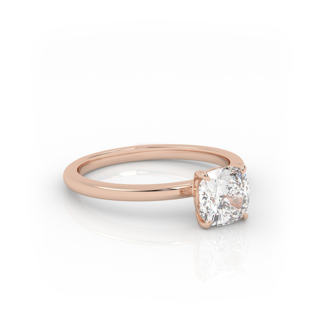 angled view of Solitaire Cushion Diamond Ring in 18K Rose Gold