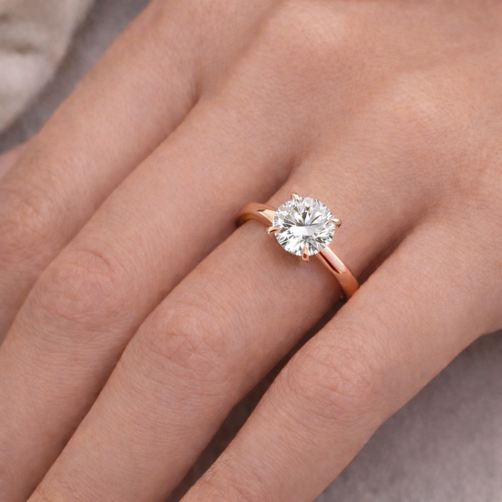 Solitaire Round Diamond Ring worn on hand in 18K Rose Gold