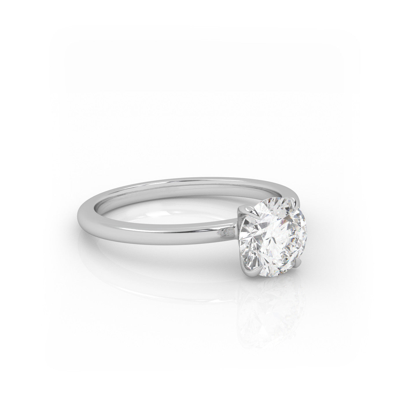 angled view of Solitaire Round Diamond Ring in 18K White Gold