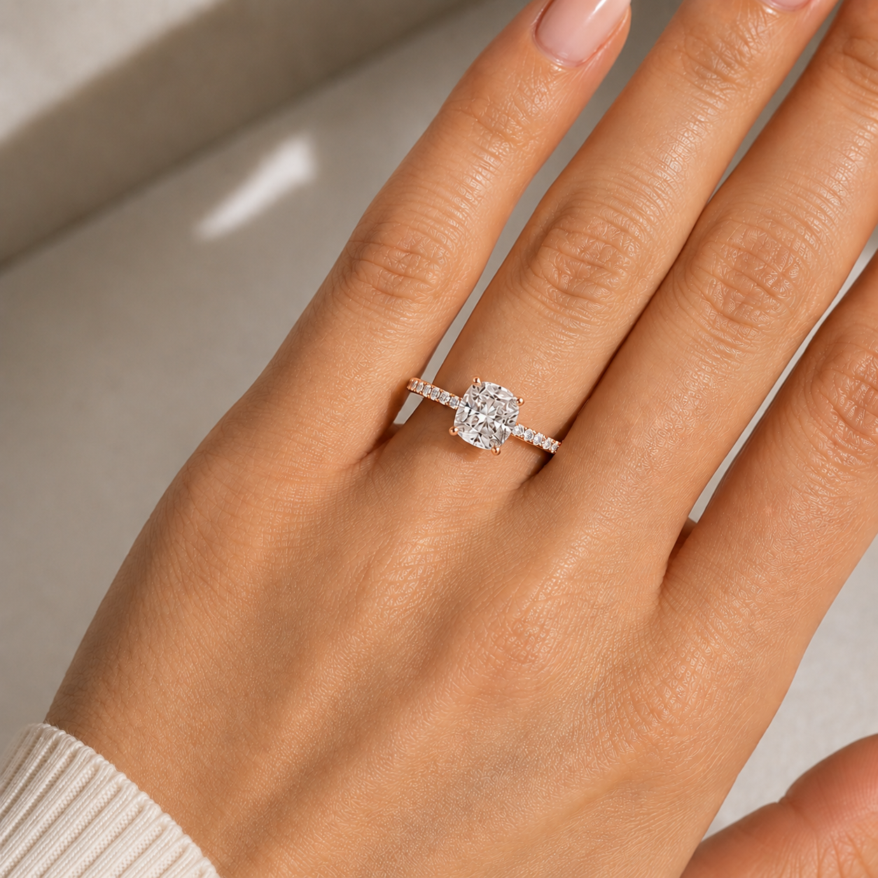 Cushion Pavé Solitaire Diamond Engagement Ring worn on hand in 18K Rose Gold