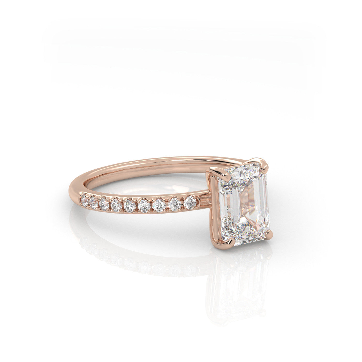 angled view of Emerald Pavé Solitaire Diamond Engagement Ring in 18K Rose Gold