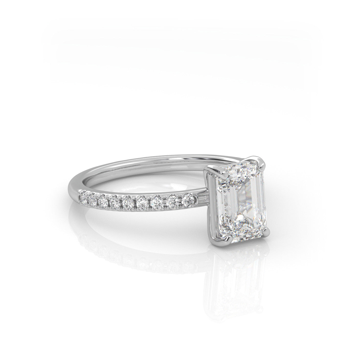 angled view of Emerald Pavé Solitaire Diamond Engagement Ring in 18K White Gold