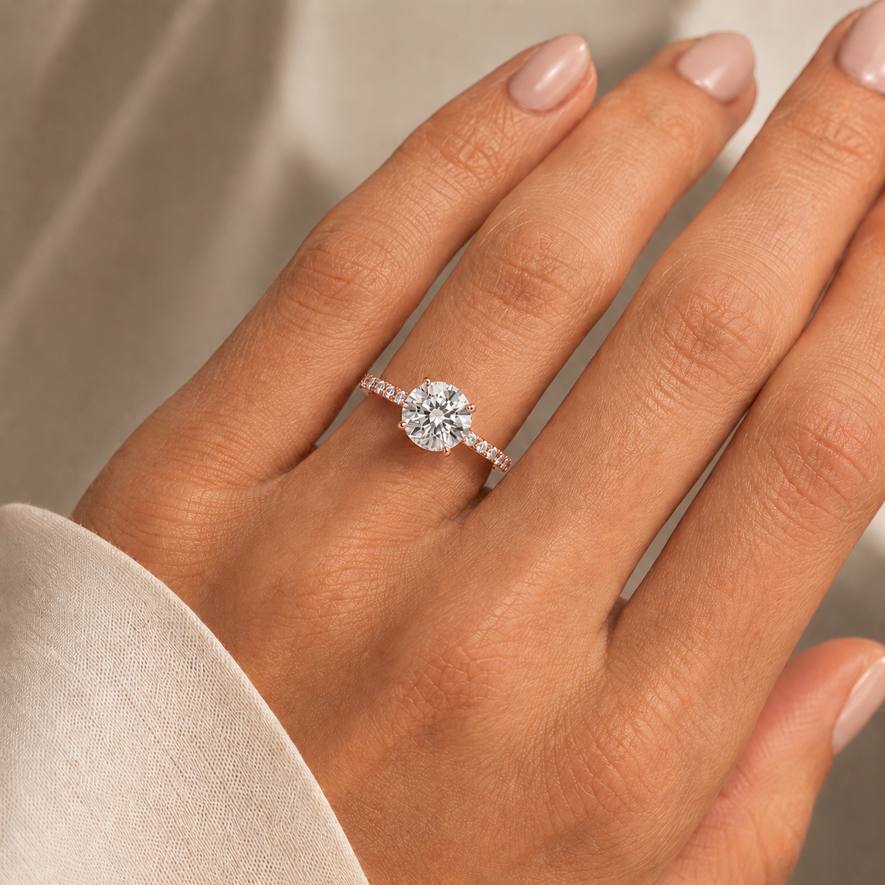 Round Pavé Solitaire Diamond Engagement Ring worn on hand in 18K Rose Gold