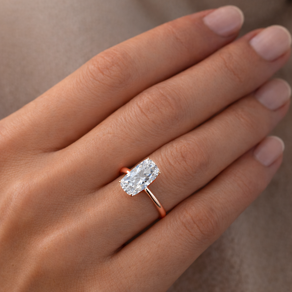 Solitaire Elongated Cushion Diamond Ring worn on hand in 18K Rose Gold