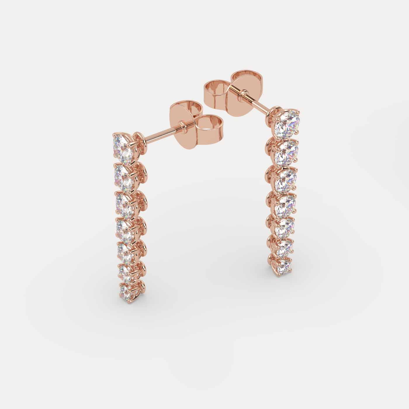angled view of Diamond Vine Drop Earrings in 18K Rose Gold