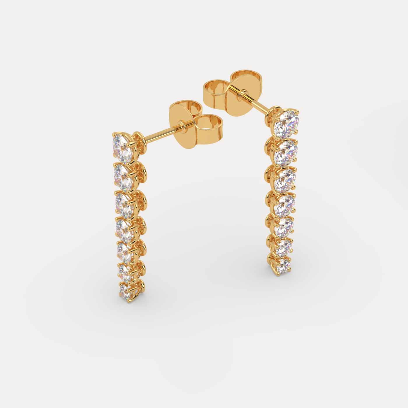 angled view of Diamond Vine Drop Earrings in 18K Yellow Gold