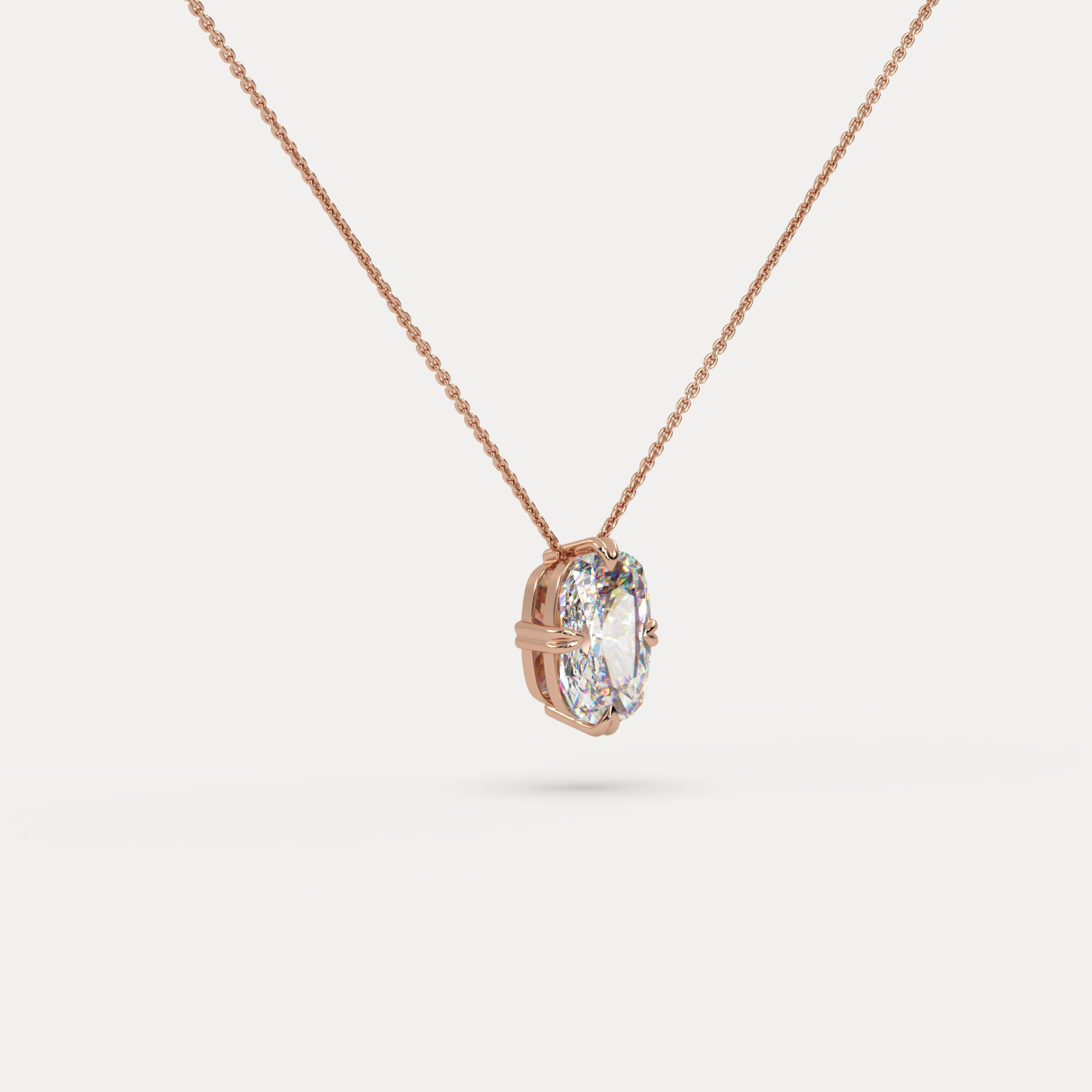 angled view of Solitaire Elongated Cushion Cut Diamond Pendant in 18K Rose Gold