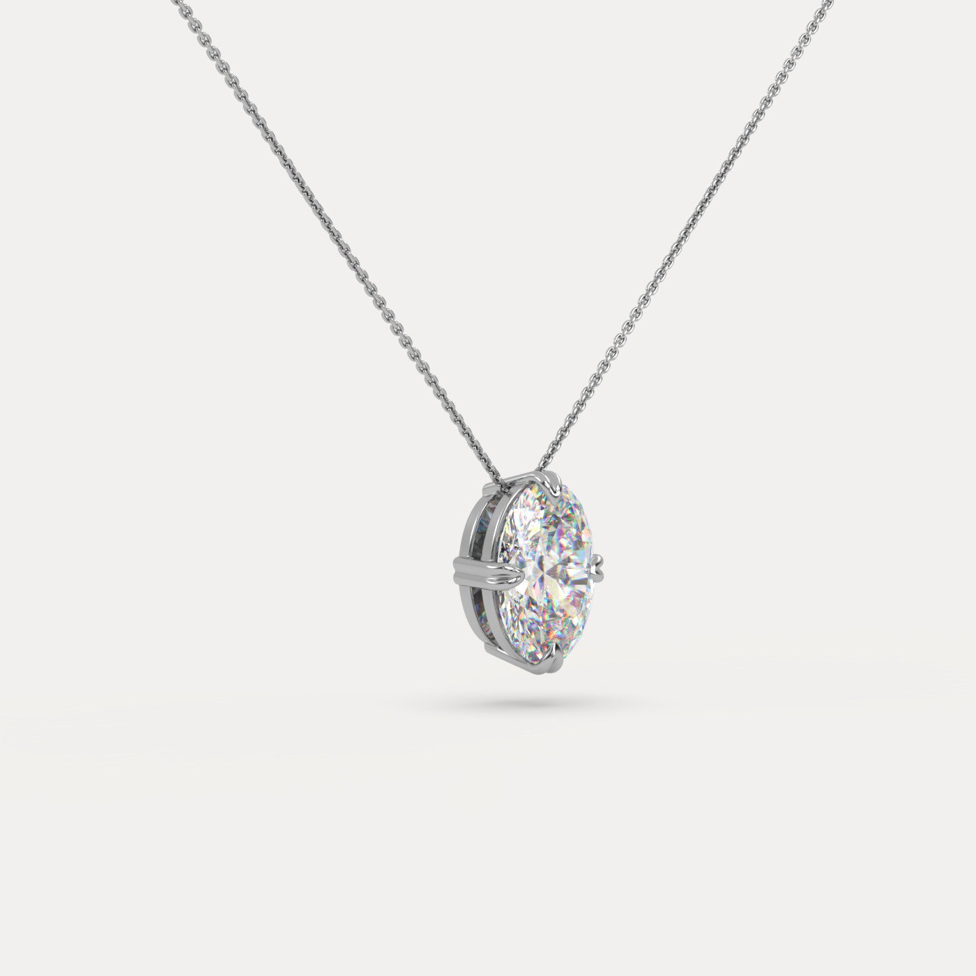 angled view of Solitaire Oval Cut Diamond Pendant in 18K White Gold