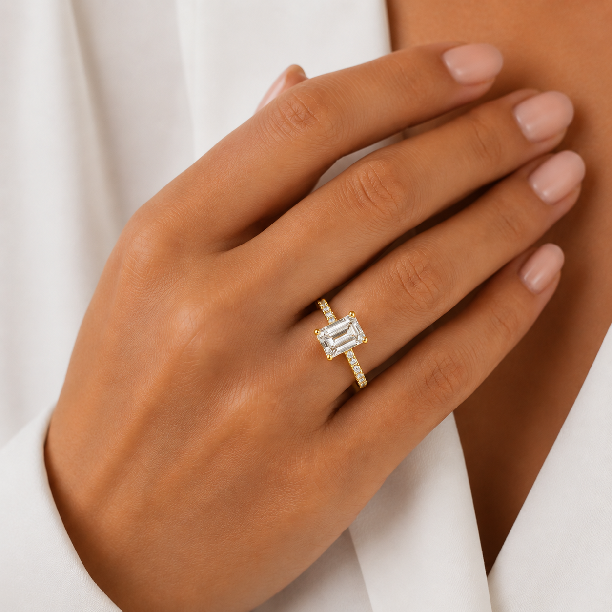 Emerald Pavé Solitaire Diamond Engagement Ring worn on hand in 18K Yellow Gold