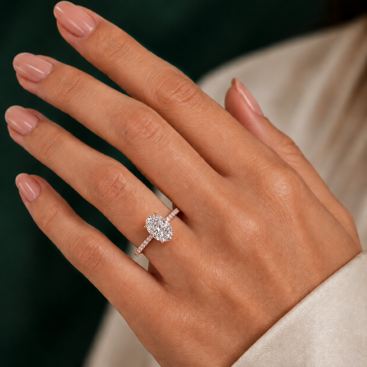 Oval Pavé Solitaire Diamond Engagement Ring worn on hand in 18K Rose Gold
