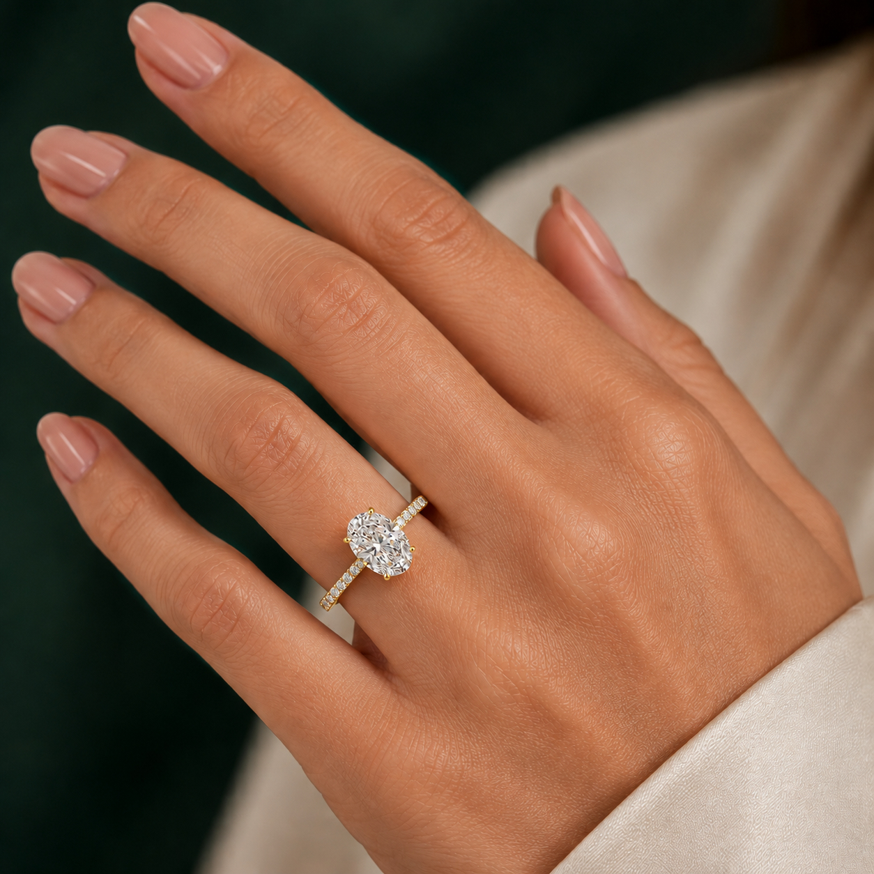 Oval Pavé Solitaire Diamond Engagement Ring worn on hand in 18K Yellow Gold