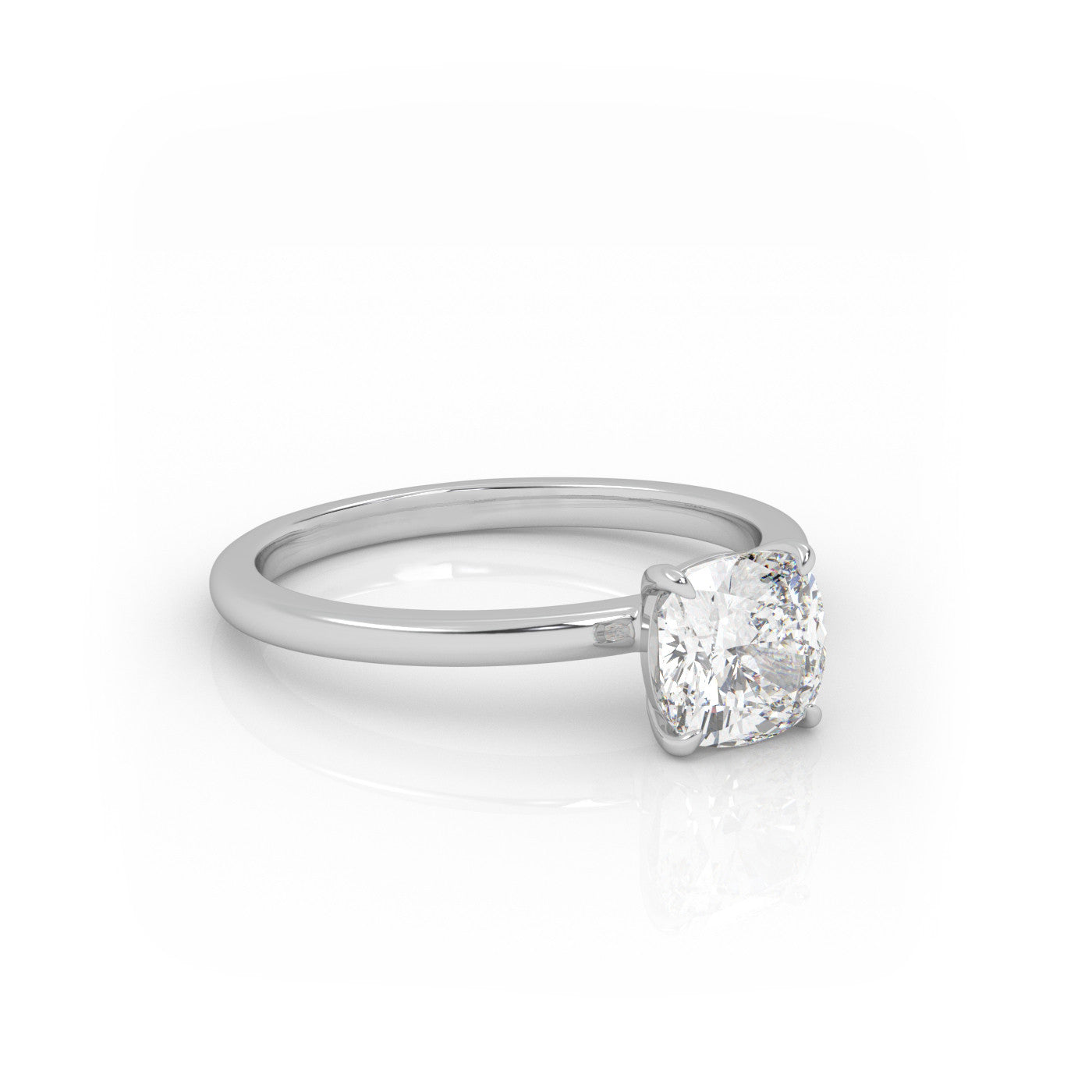 angled view of Solitaire Cushion Diamond Ring in 18K White Gold