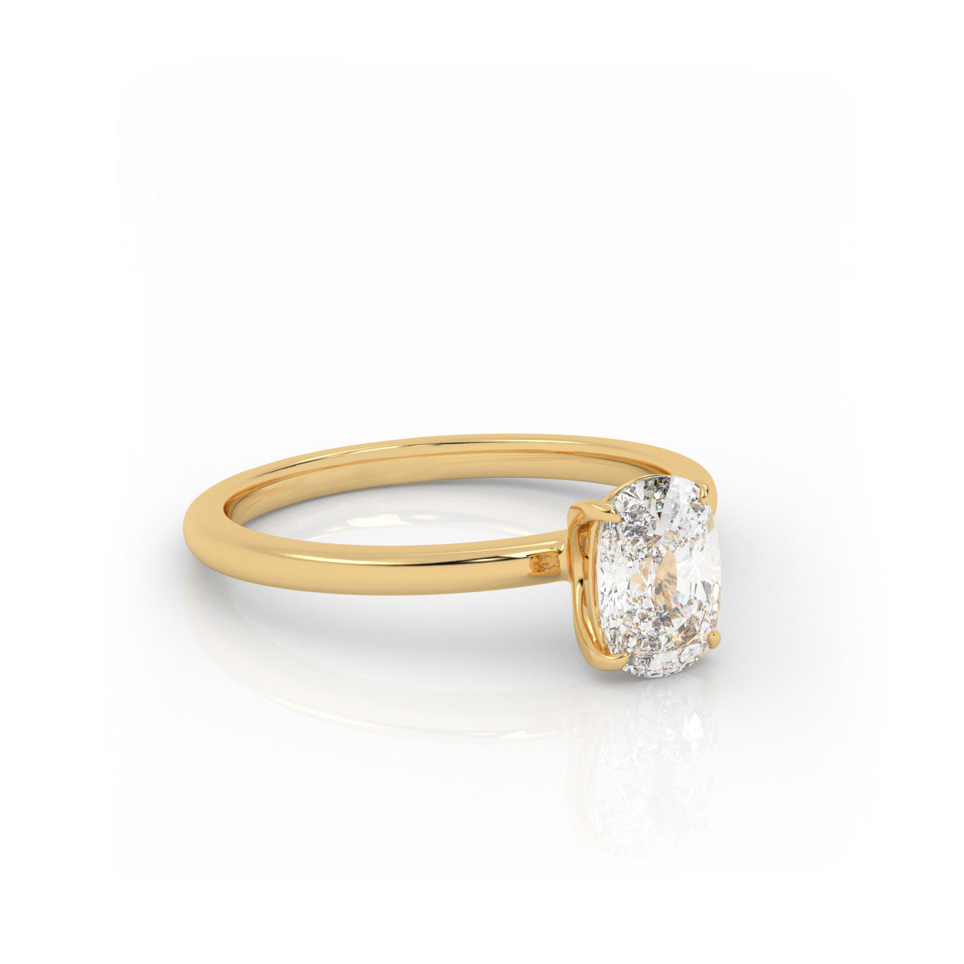 angled view of Solitaire Elongated Cushion Diamond Ring in 18K Yellow Gold