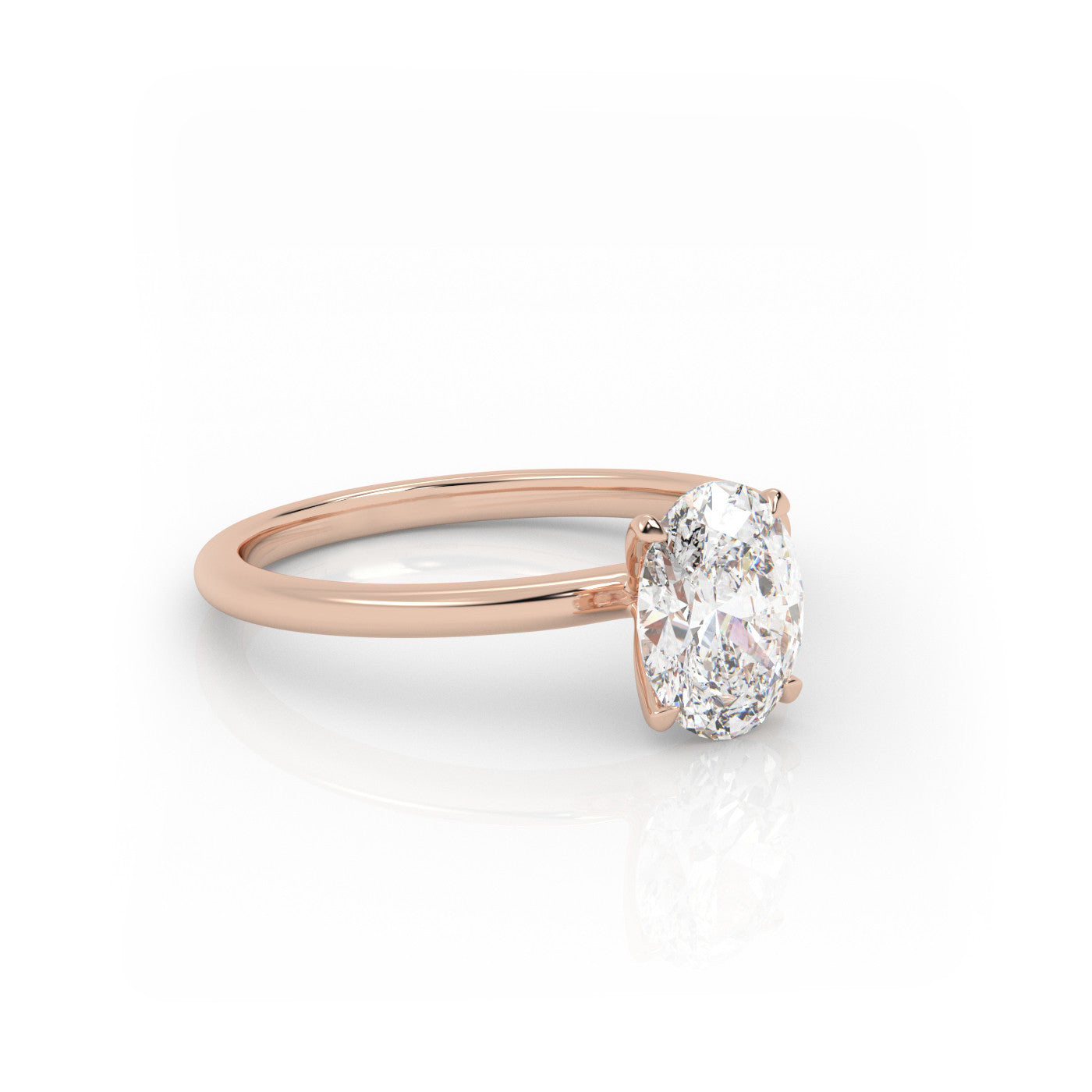 angled view of Solitaire Oval Diamond Ring in 18K Yellow Gold