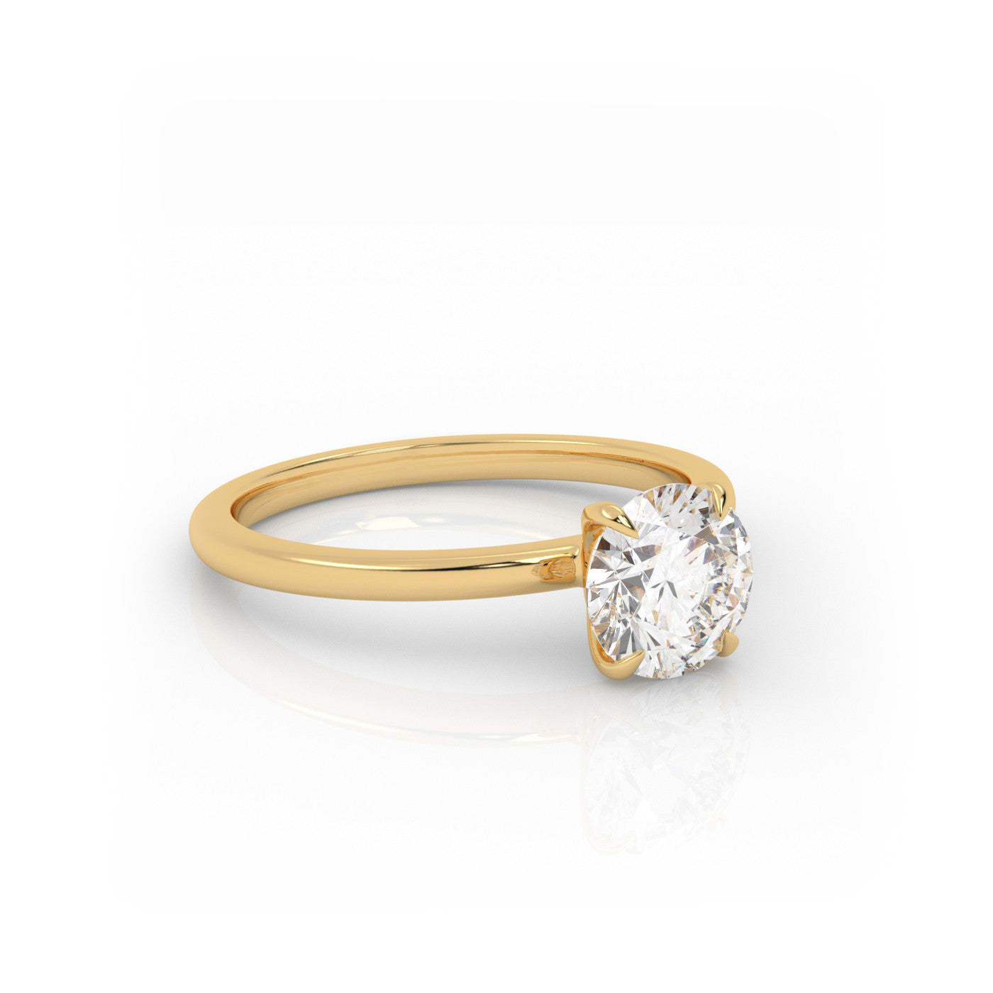 angled view of Solitaire Round Diamond Ring in 18K Yellow Gold