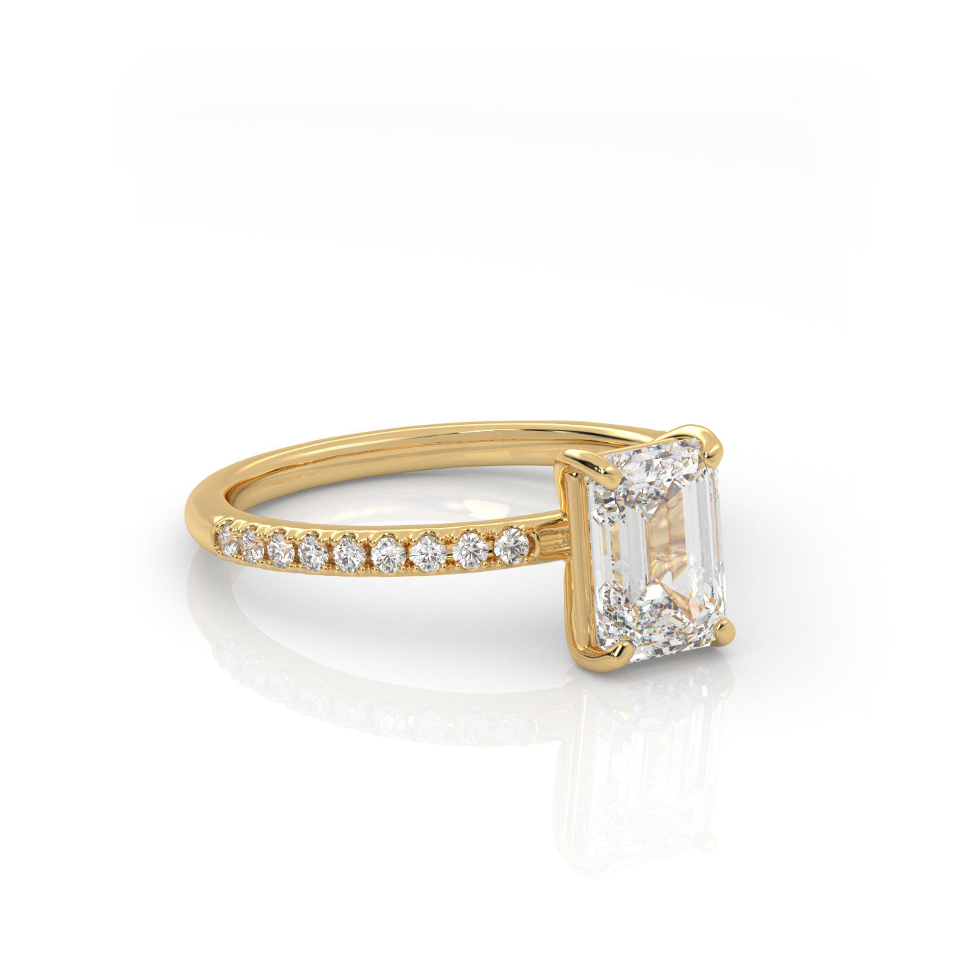 angled view of Emerald Pavé Solitaire Diamond Engagement Ring in 18K Yellow Gold