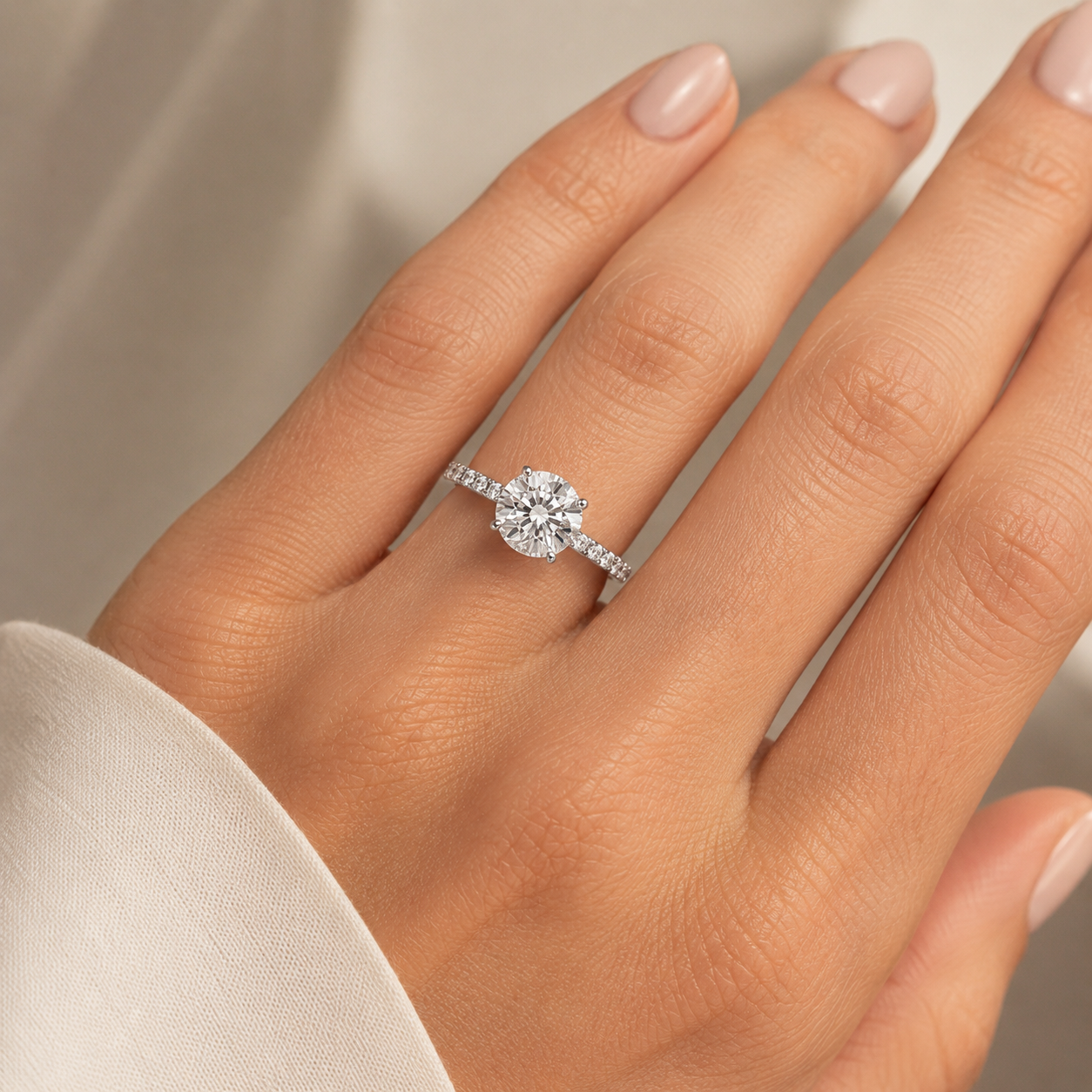 Round Pavé Solitaire Diamond Engagement Ring worn on hand in 18K White Gold