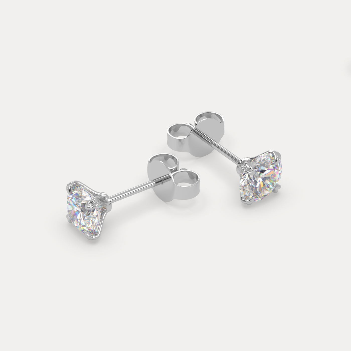 angled view of Round Cut Diamond Stud Earrings in 18K White Gold