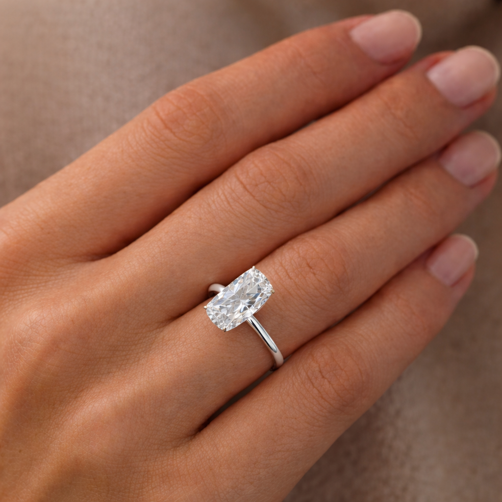 Solitaire Elongated Cushion Diamond Ring worn on hand in 18K White Gold